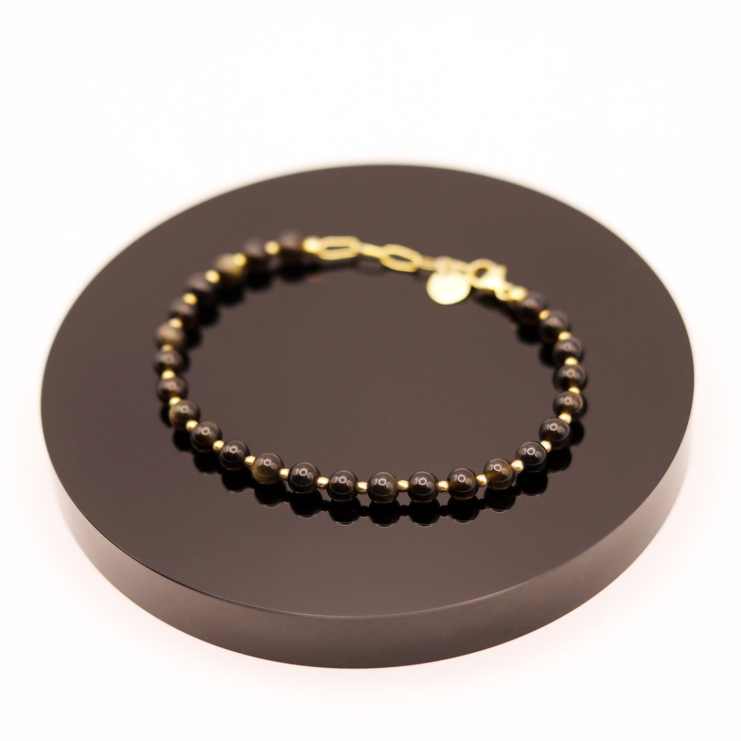 
                  
                    Pulsera Obsidiana Dorada
                  
                