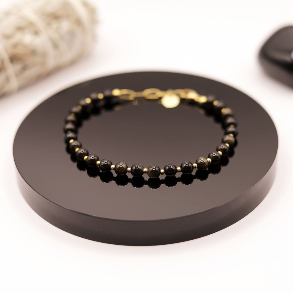 
                  
                    Pulsera Obsidiana Dorada
                  
                