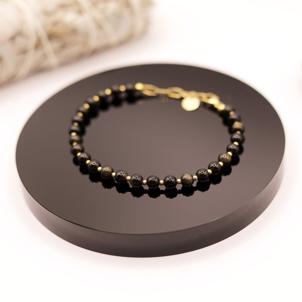 
                  
                    Pulsera Obsidiana Dorada
                  
                