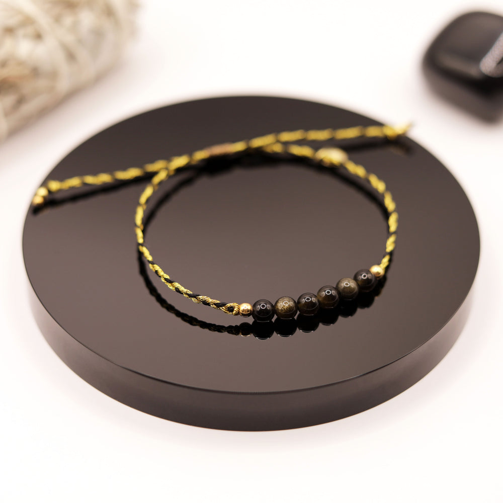 Pulsera Obsidiana Dorada Trenza