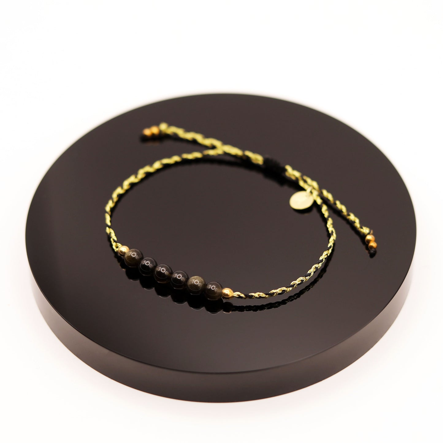 
                  
                    Pulsera Obsidiana Dorada Trenza
                  
                