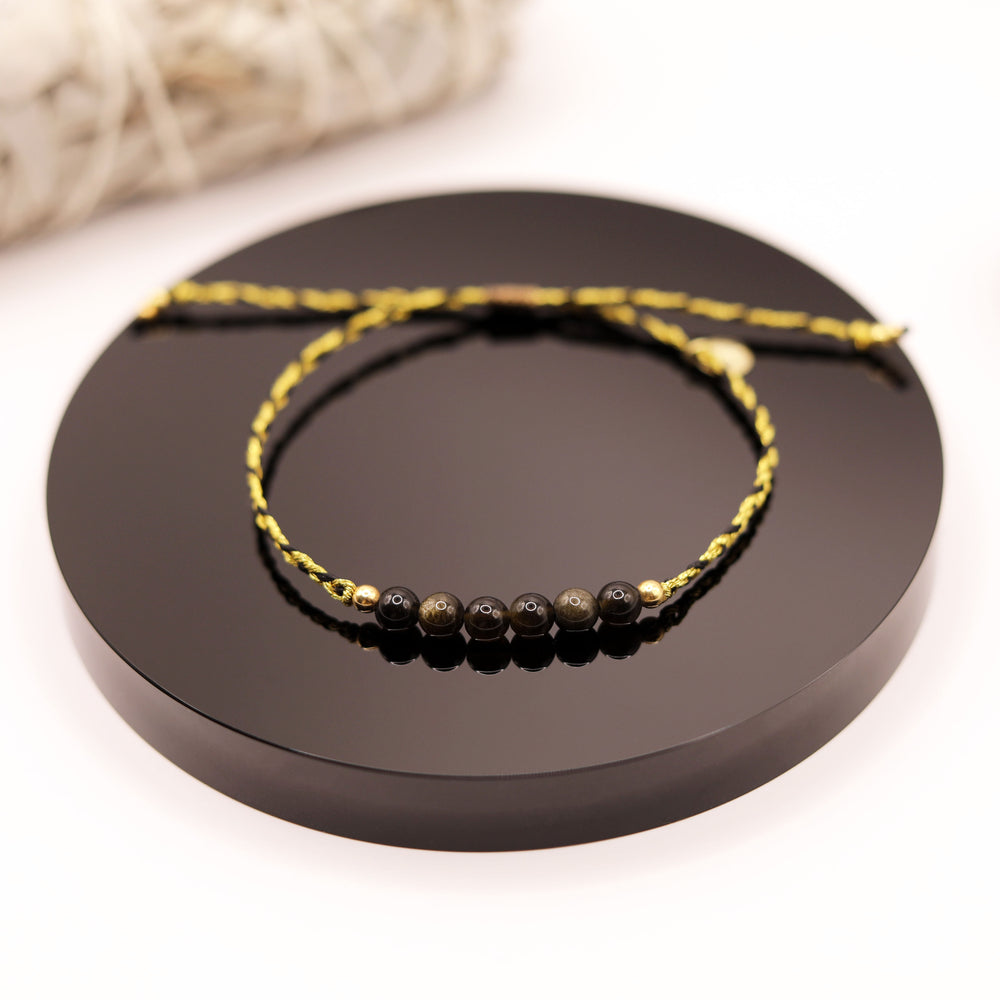 
                  
                    Pulsera Obsidiana Dorada Trenza
                  
                